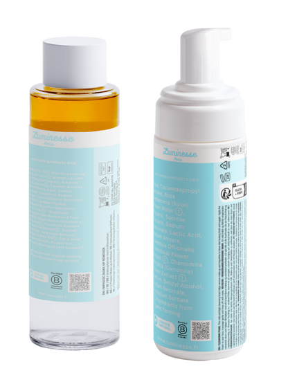 Packshot détouré du démaquillant biphasé Velvet Veil n°01 de Luminesse Paris, présenté de face sur fond transparent. Flacon transparent de 100 ml avec une phase ambrée, bouchon blanc et étiquette bleu clair. L’étiquette mentionne notamment aloe vera, camomille et framboise.