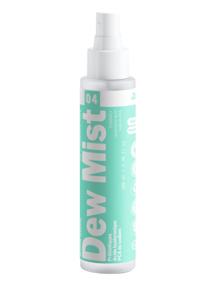 Packshot détouré de Dew Mist n°04 de Luminesse Paris, brume visage en flacon spray blanc de 100 ml avec étiquette turquoise. Le produit est présenté seul sur fond transparent ; les mentions prébiotiques, acide hyaluronique, PCA de sodium ainsi que Morning et Night sont visibles sur le packaging.