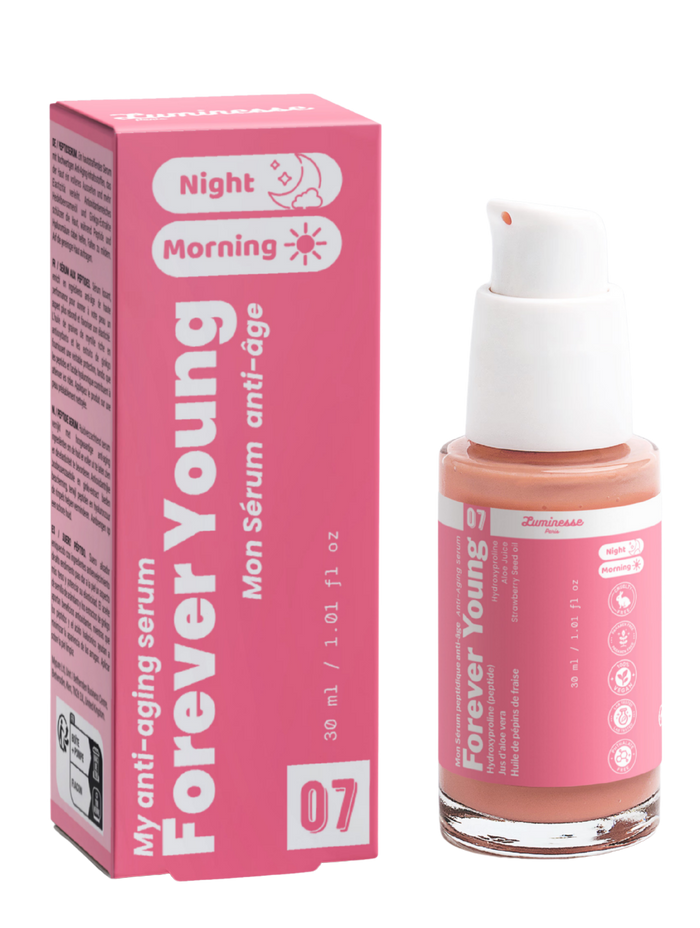Packshot de Forever Young n°07 de Luminesse Paris avec son étui rose et son flacon pompe de 30 ml contenant un sérum couleur pêche. Le produit et la boîte sont présentés côte à côte sur fond transparent ; les mentions Morning et Night sont visibles sur le packaging.