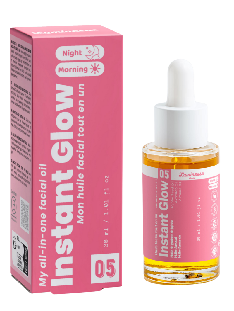 Packshot d’Instant Glow n°05 de Luminesse Paris avec son étui rose et son flacon compte-gouttes de 30 ml contenant une huile dorée. Le produit et la boîte sont présentés côte à côte sur fond transparent ; les mentions Morning et Night sont visibles sur le packaging.