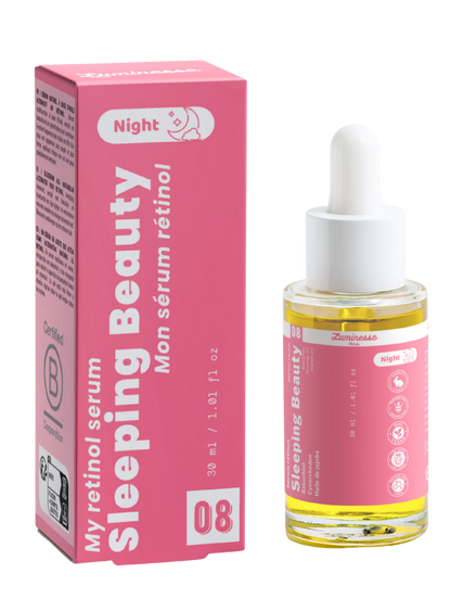 Packshot de Sleeping Beauty n°08 de Luminesse Paris avec son étui rose et son flacon compte-gouttes de 30 ml contenant une huile jaune. Le produit et la boîte sont présentés côte à côte sur fond transparent ; la mention Night est visible sur les deux packagings.