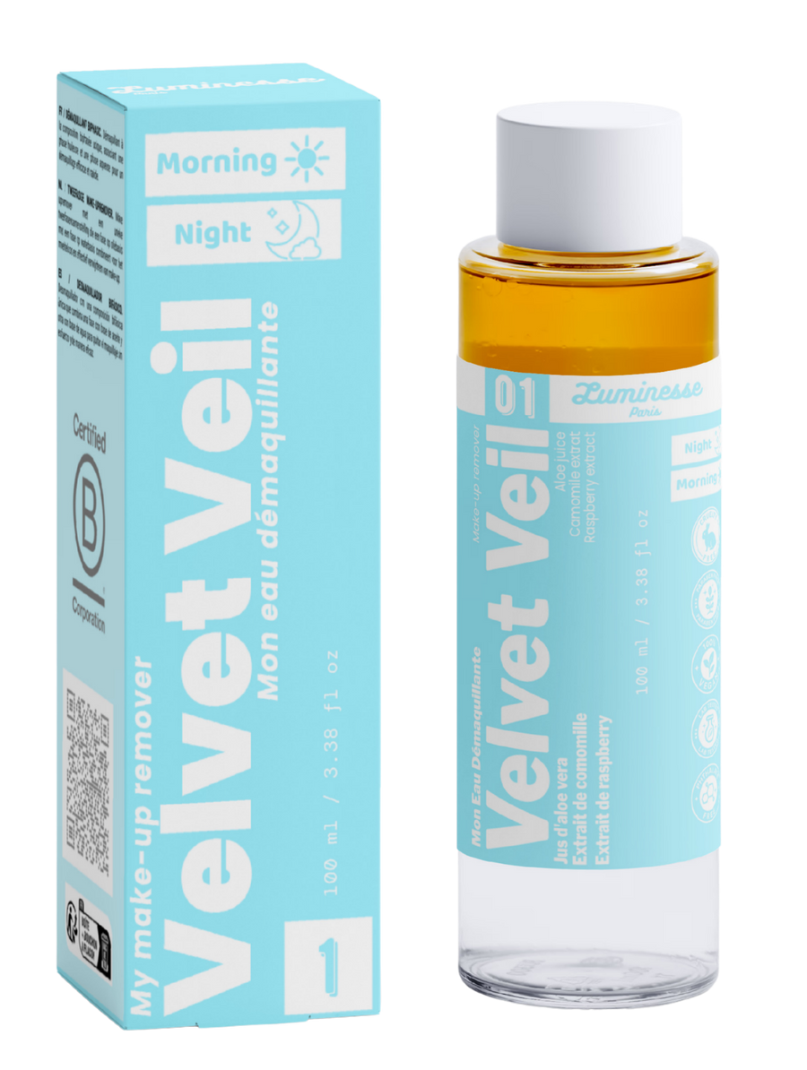 Packshot de Velvet Veil n°01 de Luminesse Paris avec son étui turquoise et son flacon biphasé de 100 ml. La boîte et le flacon sont présentés côte à côte sur fond transparent ; la phase ambrée est visible dans le flacon, avec les mentions Morning, Night, aloe vera, camomille et framboise sur le packaging.