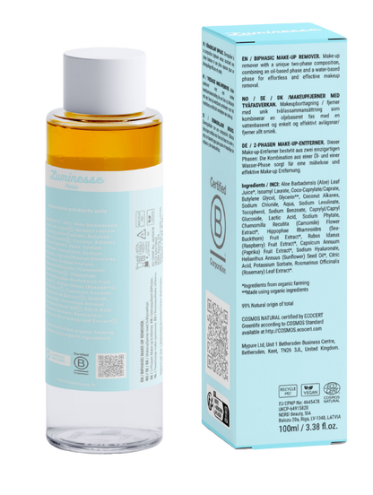 Vue arrière de Velvet Veil n°01 de Luminesse Paris avec son flacon biphasé de 100 ml et son étui turquoise sur fond transparent. Le dos du packaging présente la description du démaquillant biphasé, la liste INCI, un QR code, la certification B Corporation, les pictogrammes Vegan et COSMOS Natural ainsi que les consignes de recyclage.
